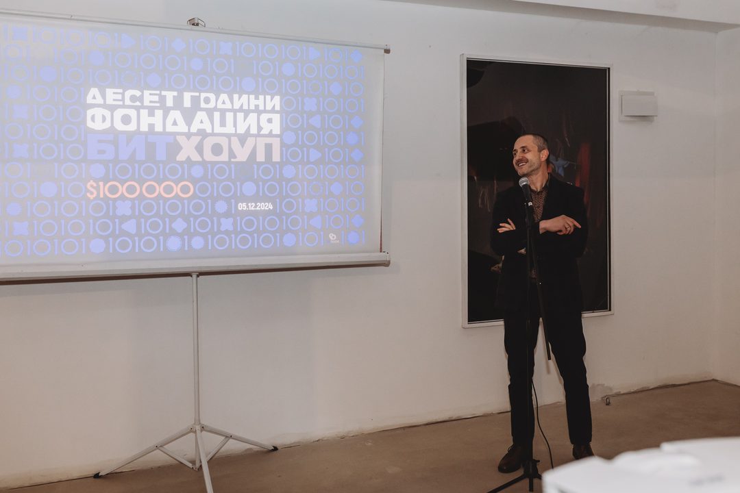 Founder Vladislav Dramaliev presents the 100,000 USD donations milestone at the Bithope Foundation 10-year anniversary, December 5, 2024.